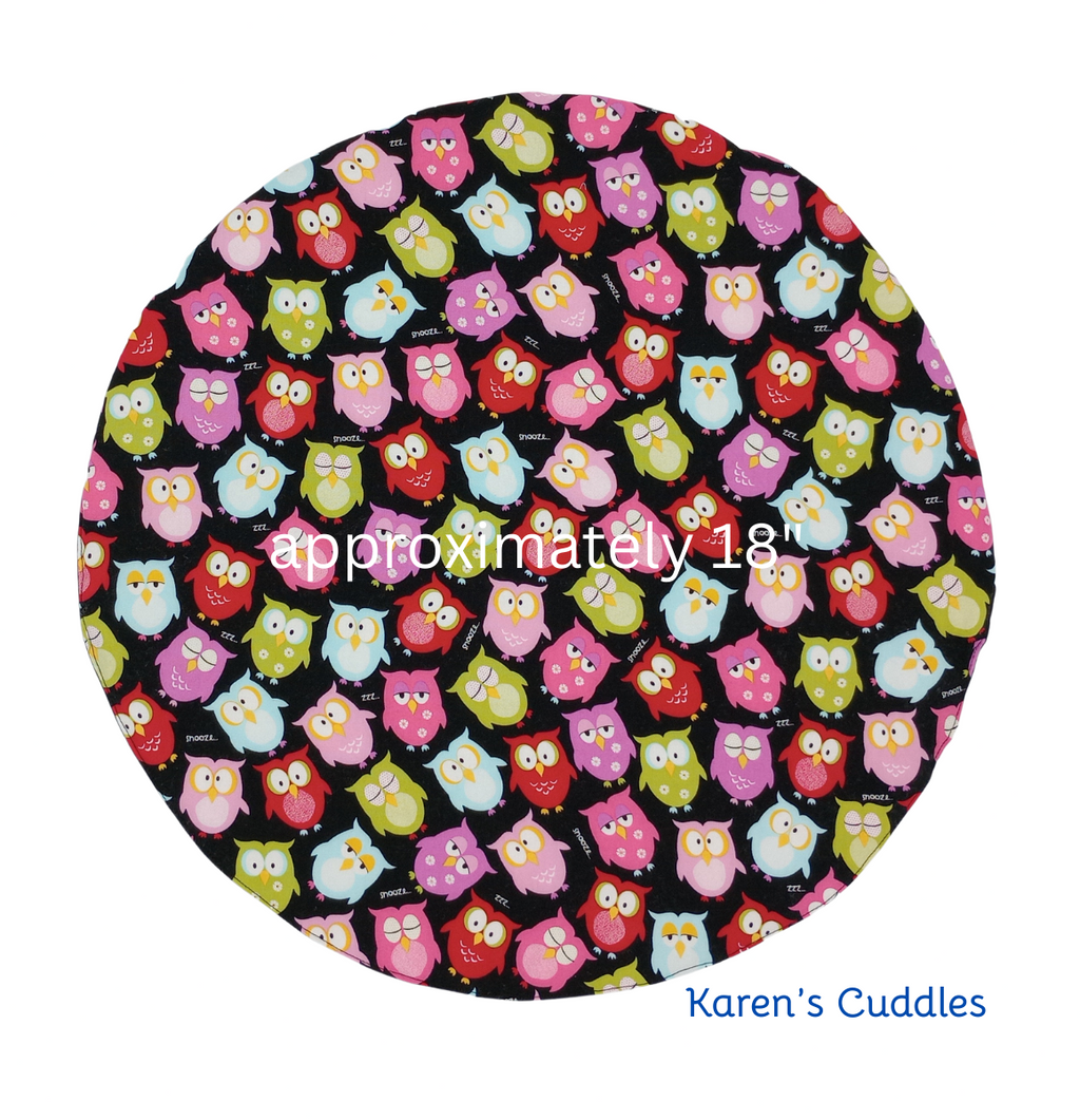 Round steering wheel cover with colorful owls on black fabric, approximately 18 inches made by Karen's Cuddles.