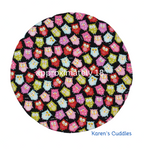 Round steering wheel cover with colorful owls on black fabric, approximately 18 inches made by Karen's Cuddles.
