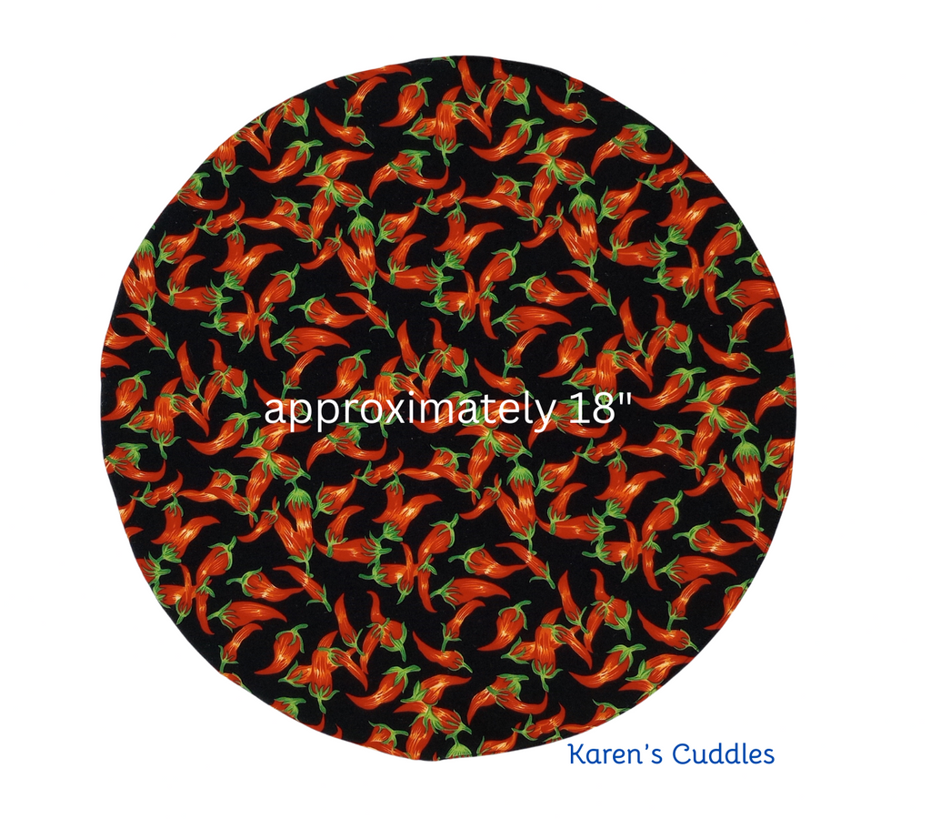 Steering Wheel Covers/Sun Shades - Chili Peppers
Help keep your steering wheel a little cooler and minimize sun exposure, especially during these hot summer days by slipping this cover over your steering wheel before leaving your car. 
This cover features Chili Peppers on one side and solid black on the other; made of 100% cotton fabric and lined with two layers of a cotton/polyester blend batting. 
Approximately 18" and fits most steering wheels. 
SAFETY ALERT: Please do not operate vehicle while the cover