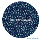 round blue fabric with paw prints and dog bones with dimensions