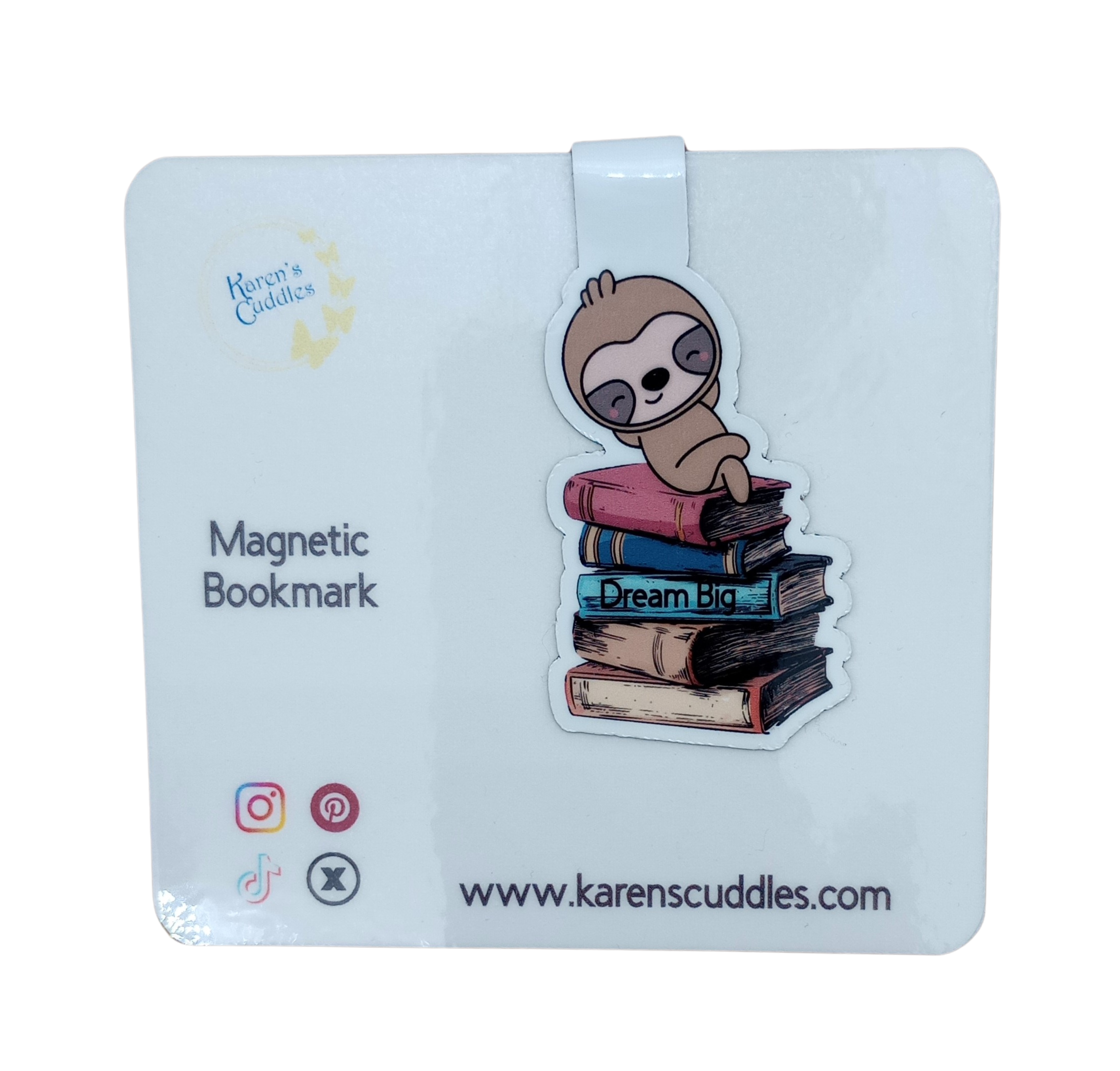 magnetic book mark with a sloth sleeping on a stack of books titled "Dream Big"