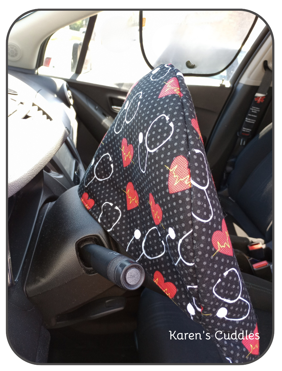 Steering Wheel cover with medical-themed design in a car interior