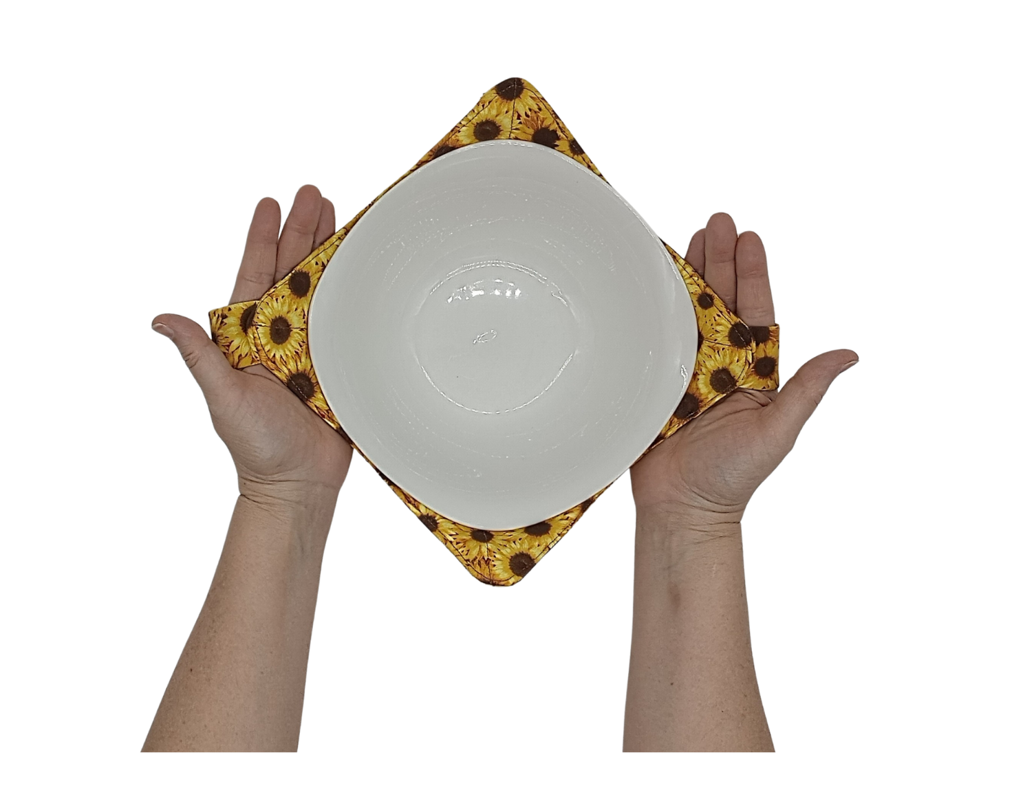 Hands holding a yellow and brown sunflower fabric bowl holder by sliding through the fabric straps on both sides