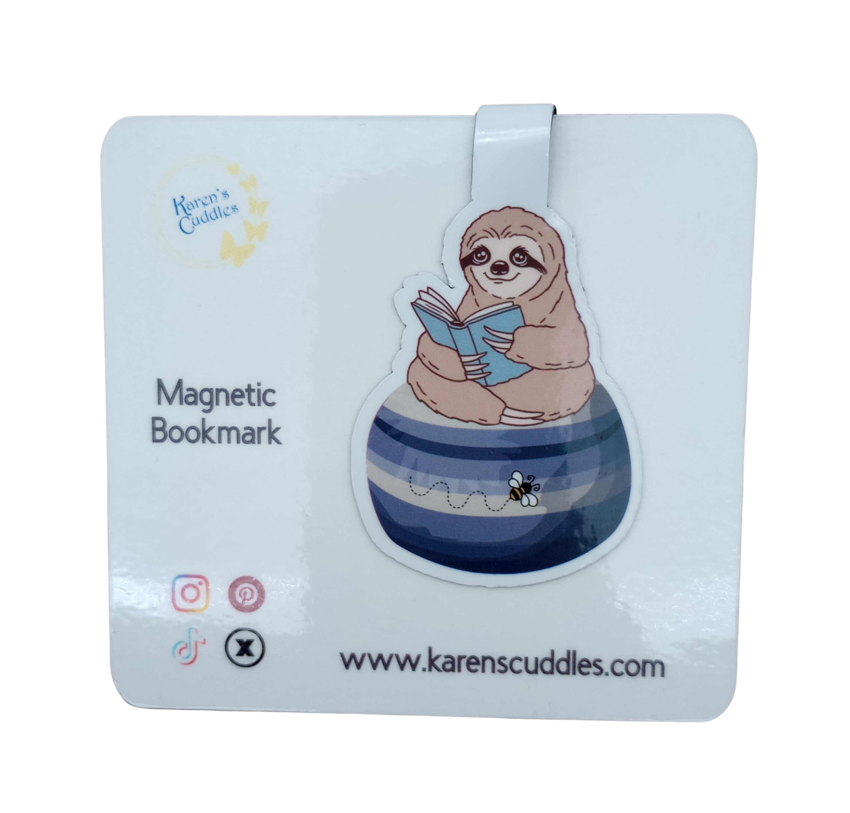 Magnetic bookmark with a sloth reading a book while sitting on a blue beanbag with a bumble bee on it