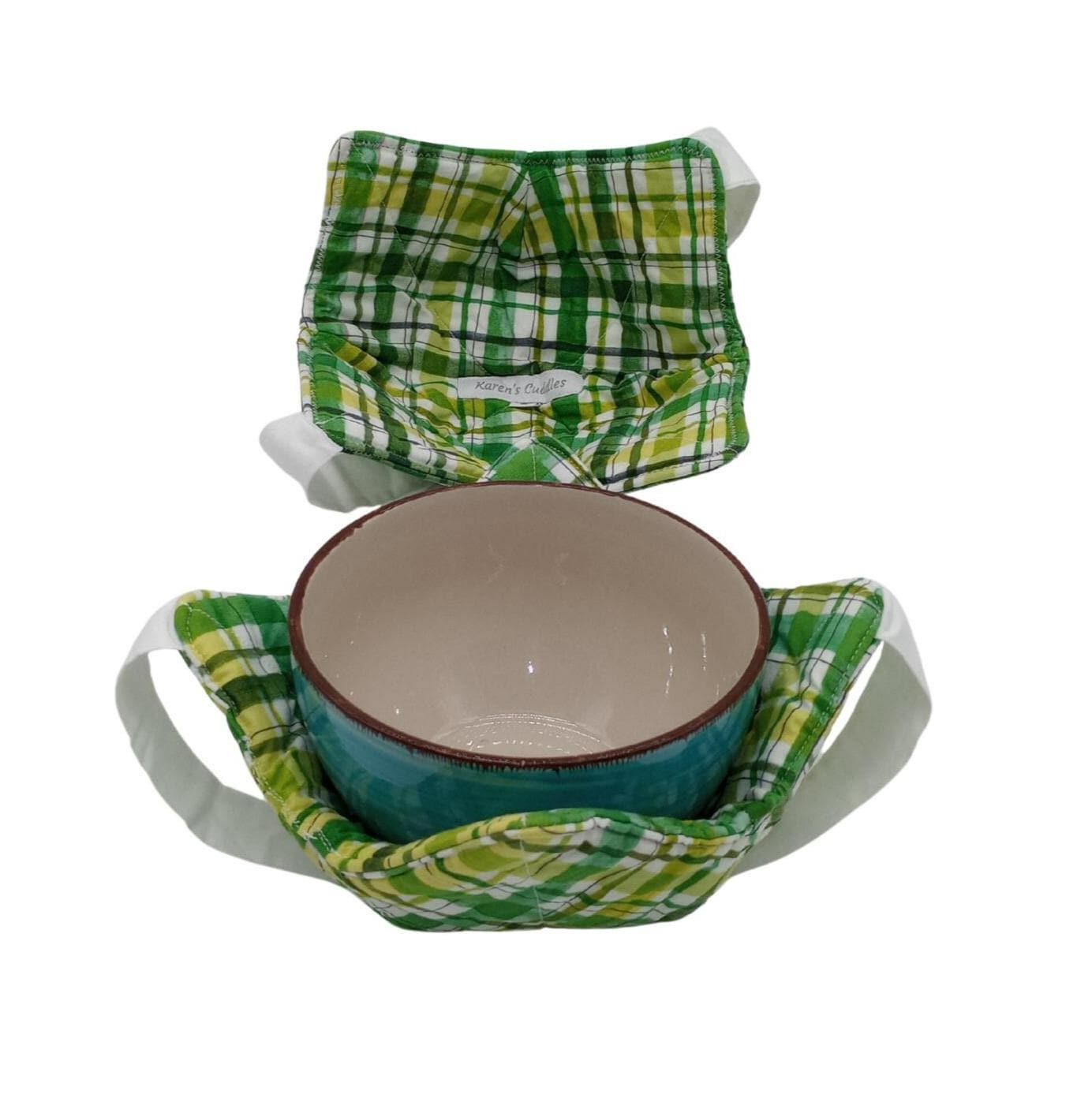 This St. Patrick&#39;s Day themed bowl cozy features green and white stripes with a white strap for hand support. 
Bowl Cozies are hot pads designed to protect your hands from extreme temperatures, from reheating leftovers in the  microwave to using as a placements, a unique addition to your kitchen!  Also make great gifts to show someone you care!