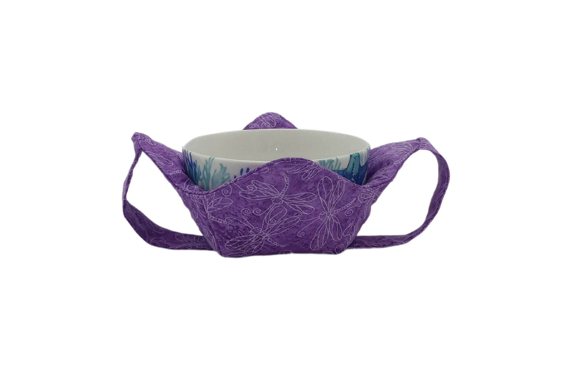 white outlines of dragonflies on a calico purple fabric bowl shaped holder with bowl resting inside and a matching fabric strap underneath the holder