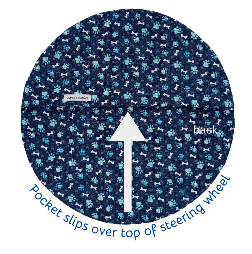 Blue steering wheel cover with paw print pattern on a white background