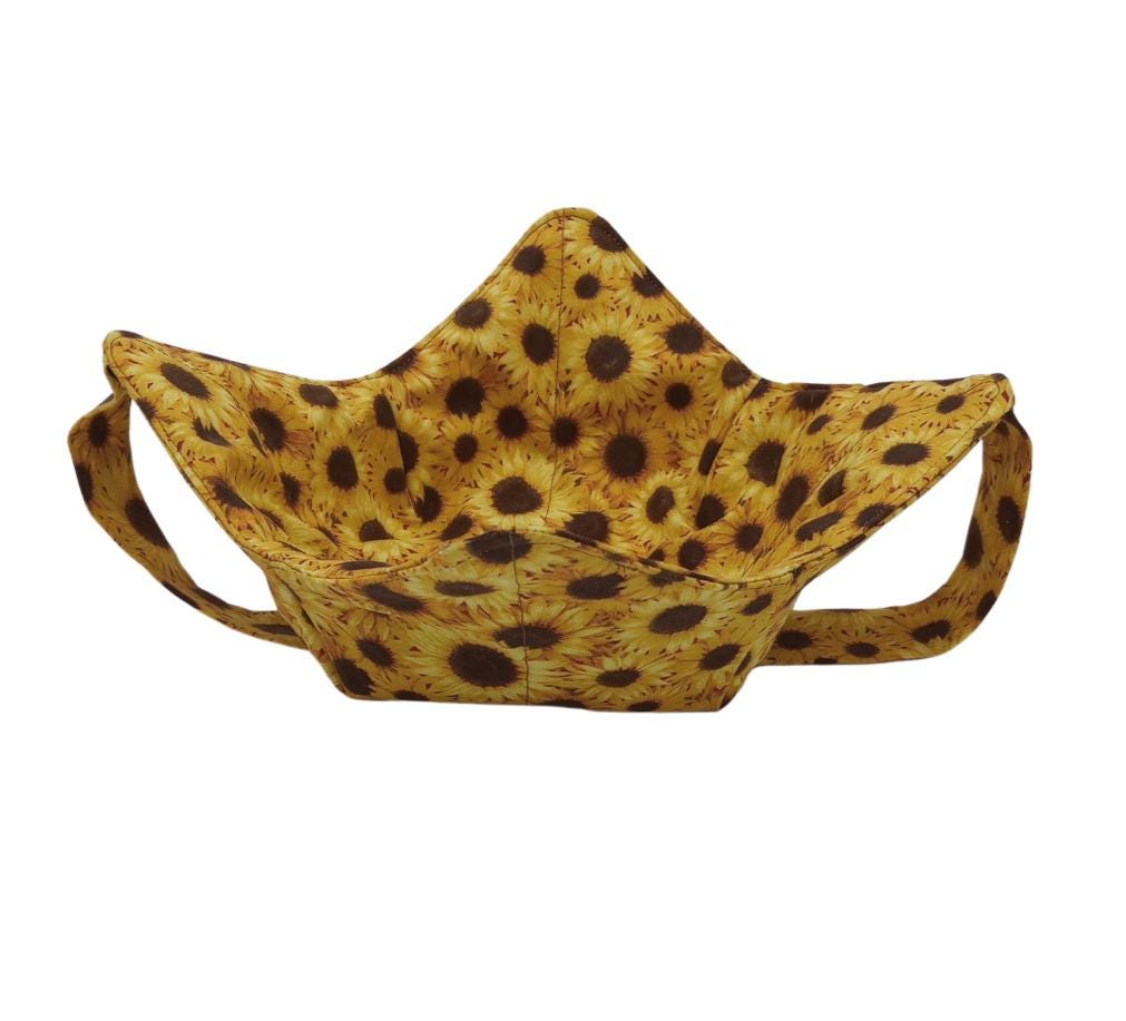 yellow and brown sunflower fabric bowl shaped hot pad with a matching fabric strap under the holder